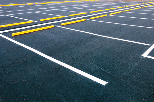 a freshly seal coated and painted parking lot